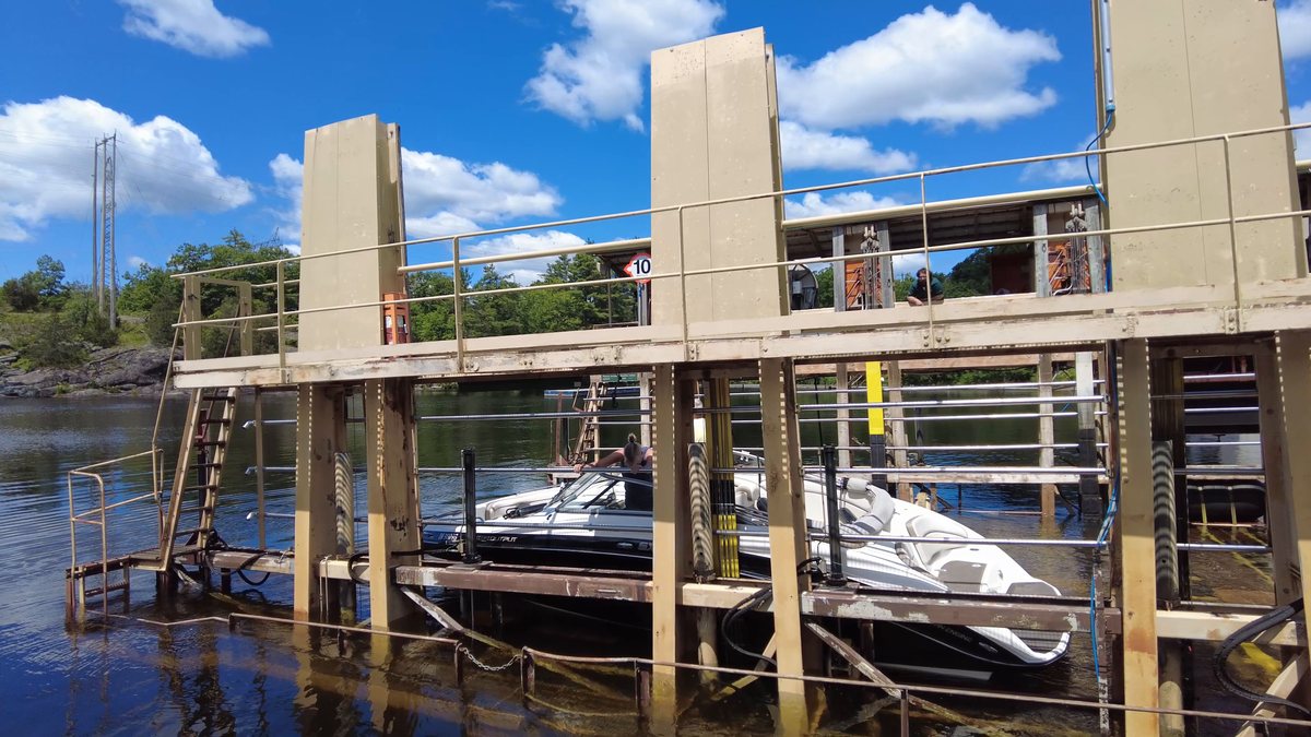 Boats sitting on the Big Chute marine railway carriage, lifted clear of the water on rails rather than floating in a lock chamber